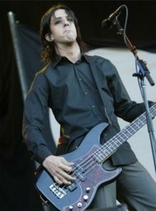 Jeordie White performing on bass