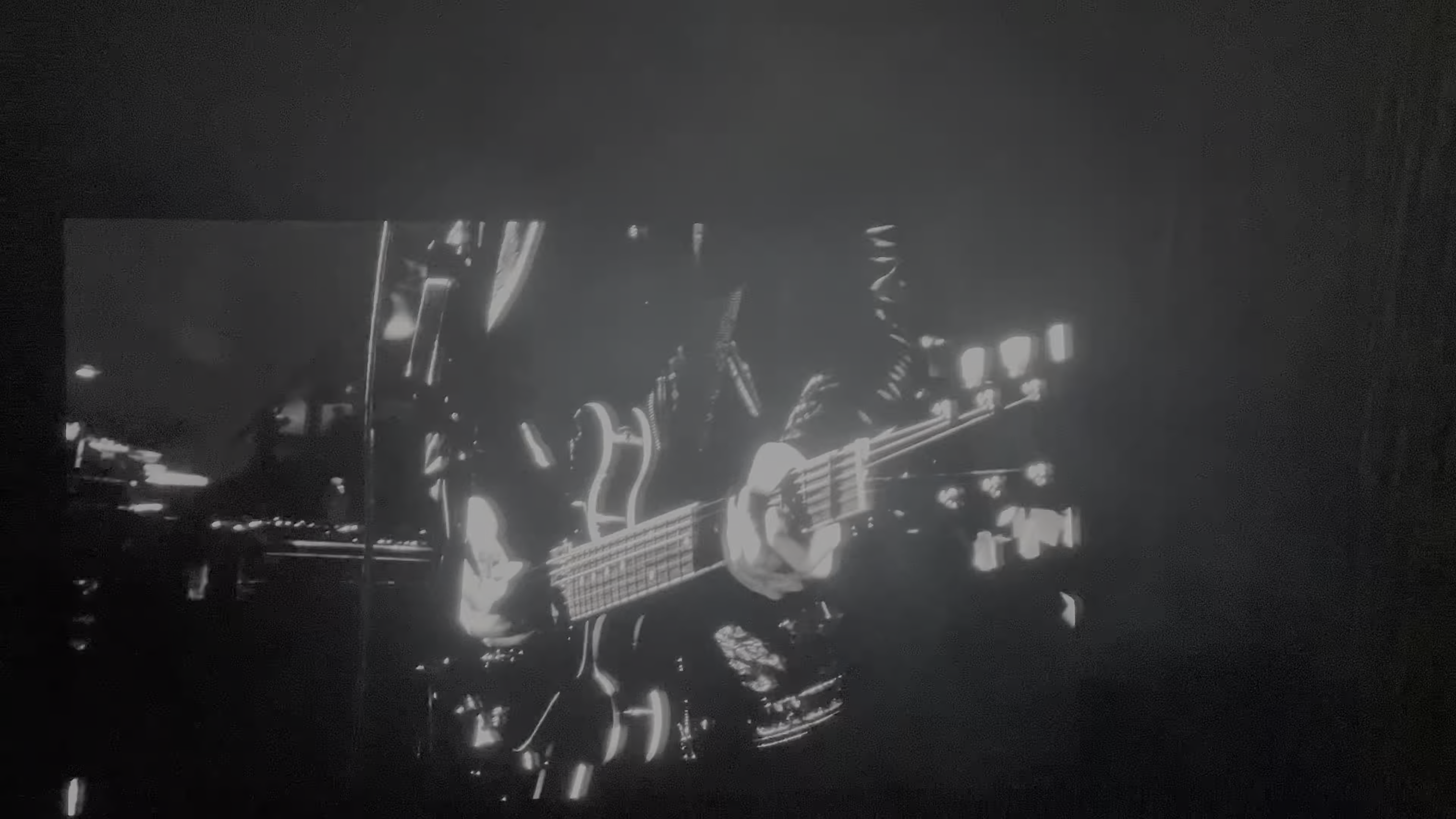 Bass guitar imagery during a Nine Inch Nails performance