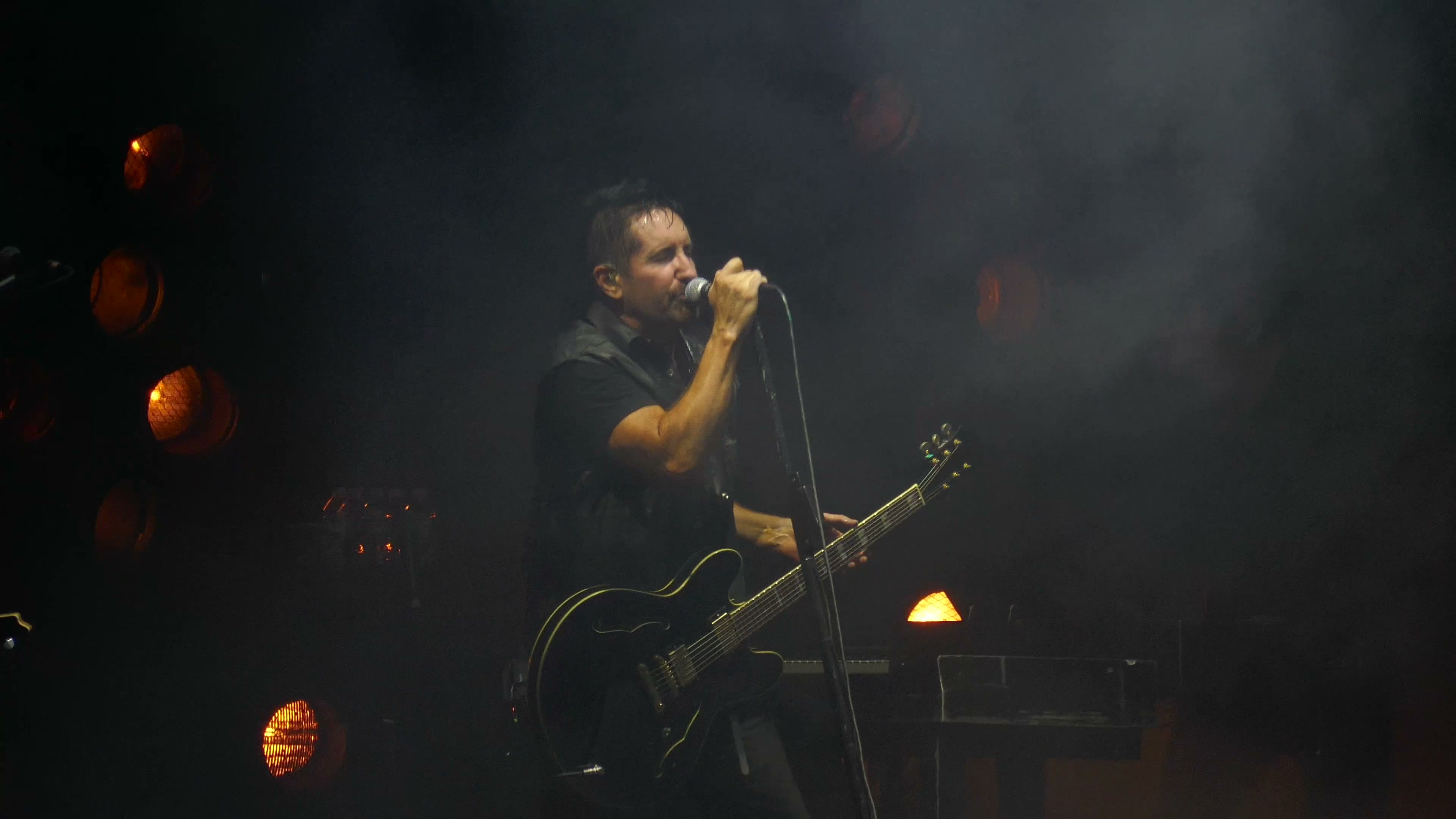 Trent Reznor performing with guitar